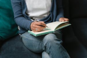 writing in a notebook